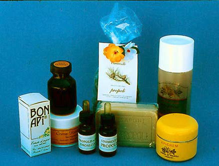 Various products containing propolis (from left to right): extracts of various concentrations, revitalizing cream,  extracts with dropper, caramels, soap, shampoo and night cream.