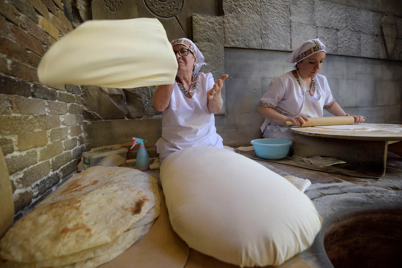 Women bake the famous Armenian bread Lavash at Sherep Restaurant.