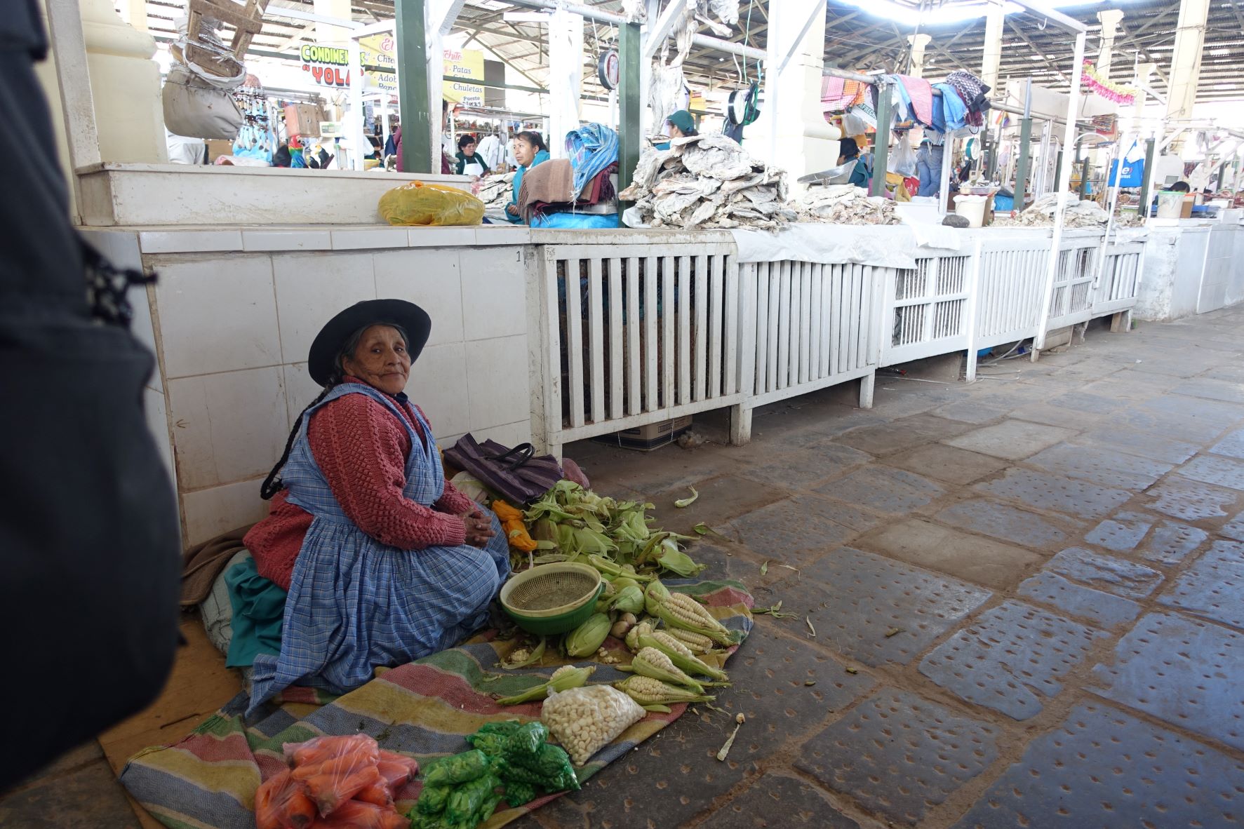 Indigenous woman selling products at a market, Perú, August 2018.