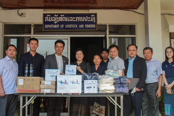 FAO Lao PDR and government staff in front of promotional materials related to AMR and ASF