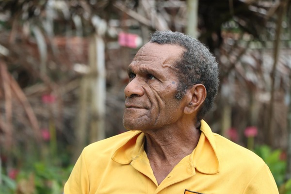 Michael Butuhe, a retired primary-level teacher and head of the village business group.