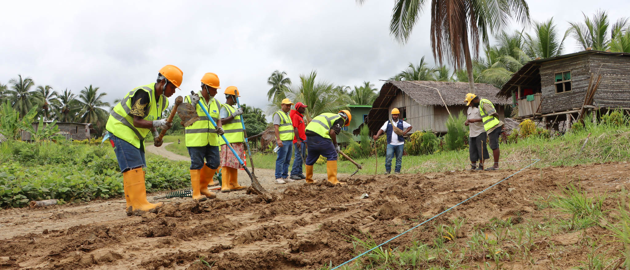 Road Maintenace Group woking on a Farm-to-Market access road in Papua New Guinea
