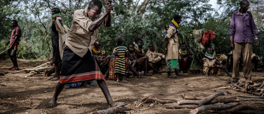 Kenya, people chopping wood for energy